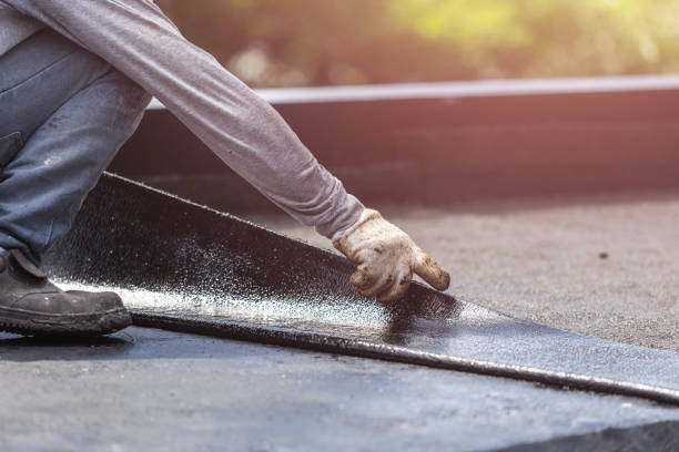 Professional Basement Waterproofing technician working in Washington, VA